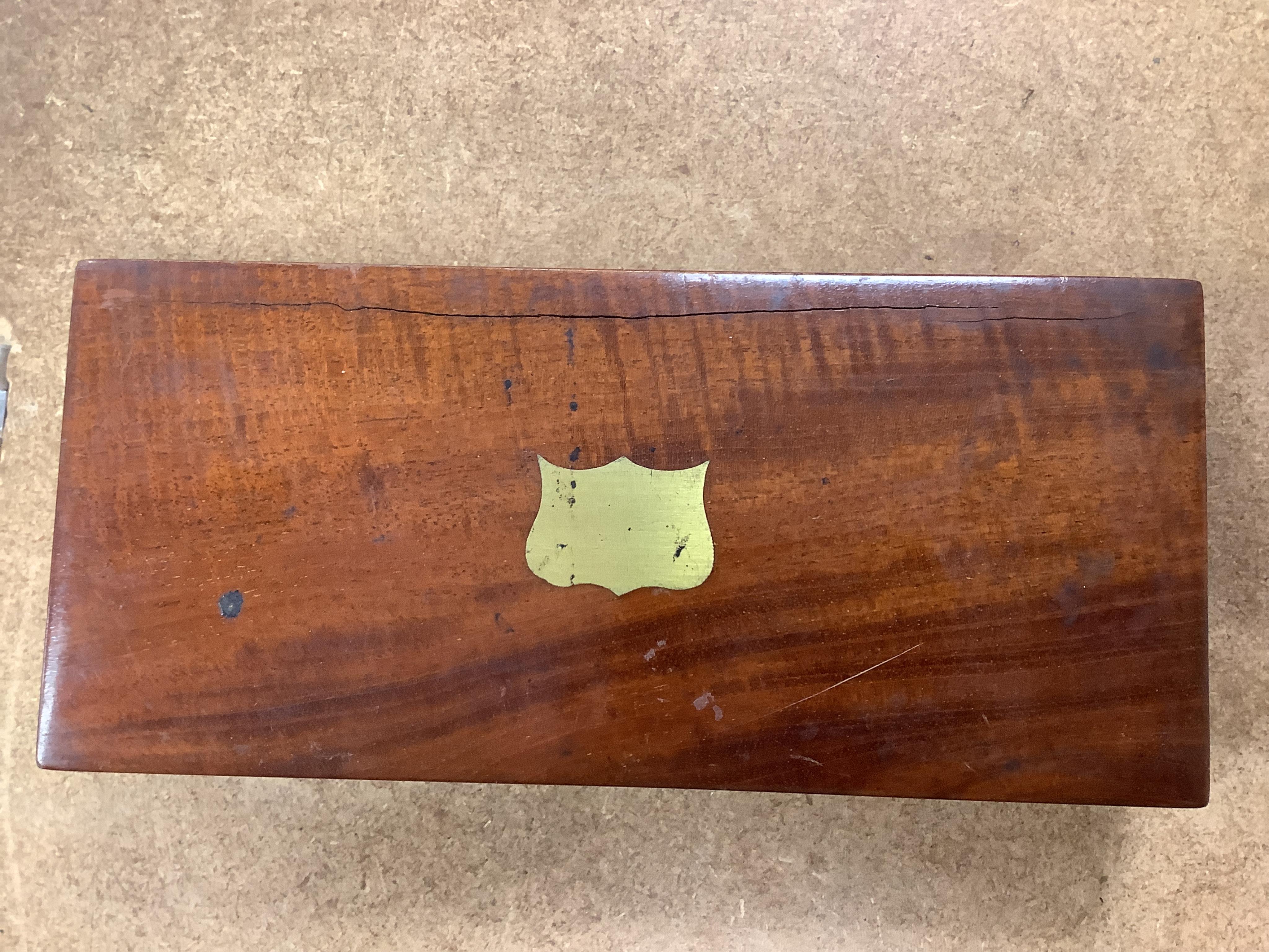 A 19th century mahogany cased surgeon’s set of steel surgical instruments by S. Maw Son & Thompson, London, comprising of an amputation saw, scalpel, a hammer, etc., dimensions of the case; 23.5cm wide, 10.5cm deep, 4cm